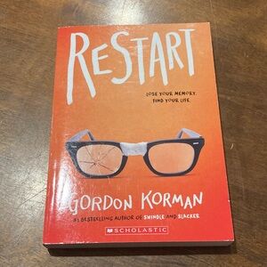Scholastic Restart by Gordon Korman - Orange Cover with Glasses Art